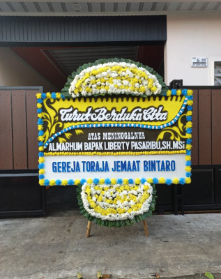 Papan Bunga Duka di Botumoito